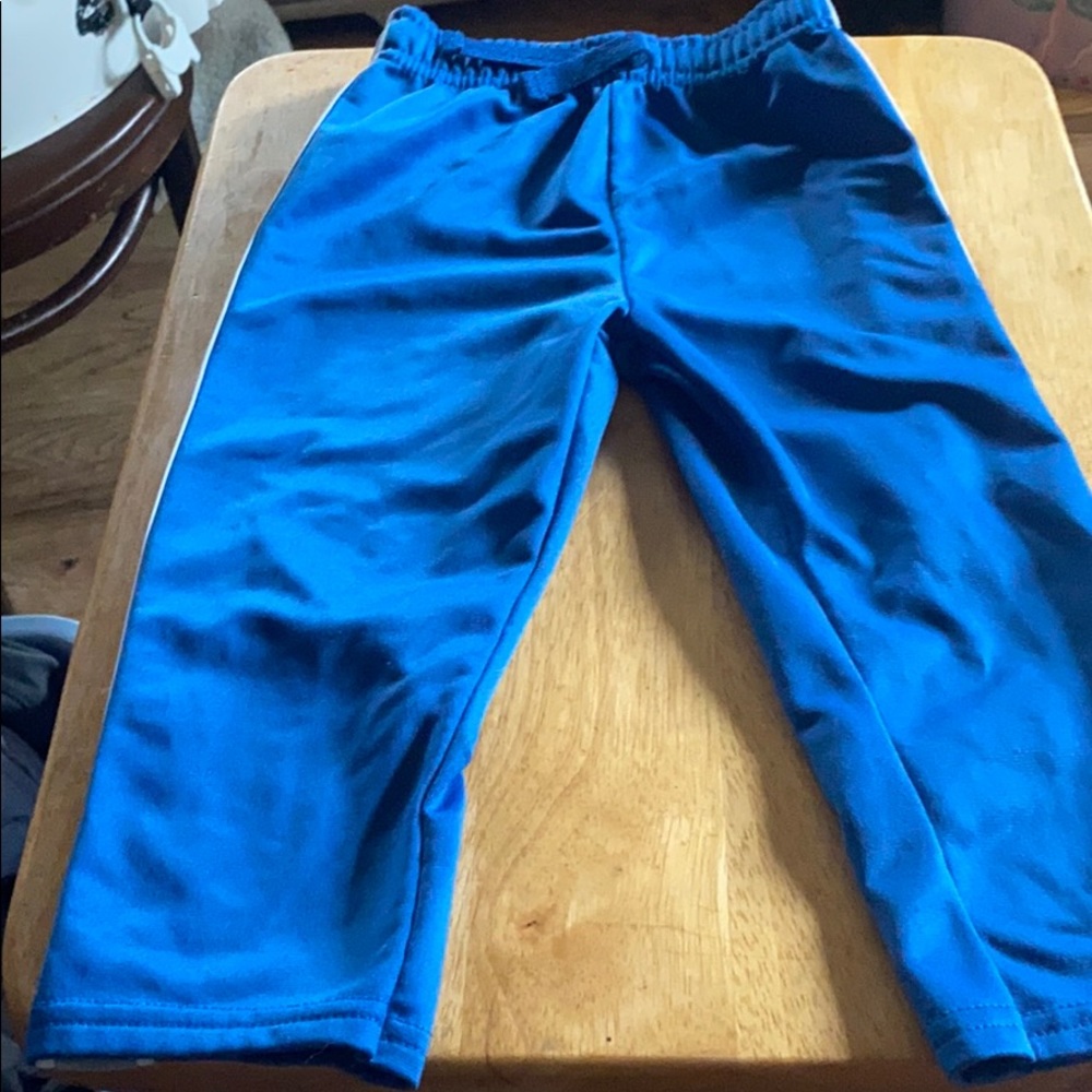 Blue sweatpants with grey and white stripe